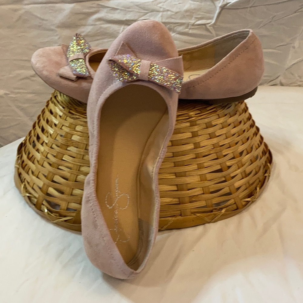 Pink ballet flats with bow detail